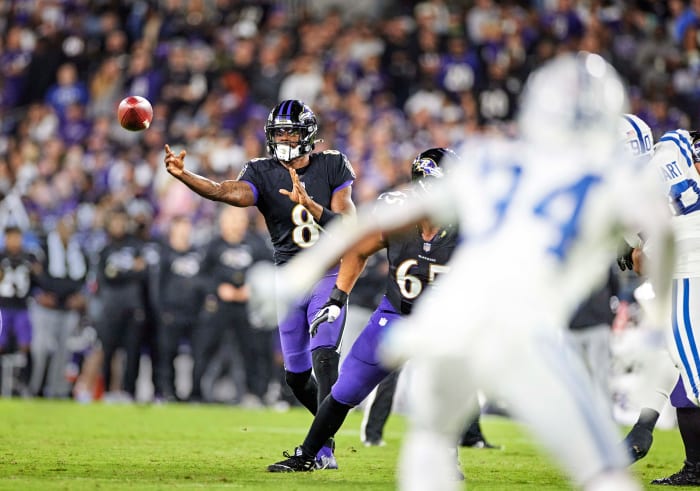 Lamar Jackson throws a sidearm pass during a game against the Colts